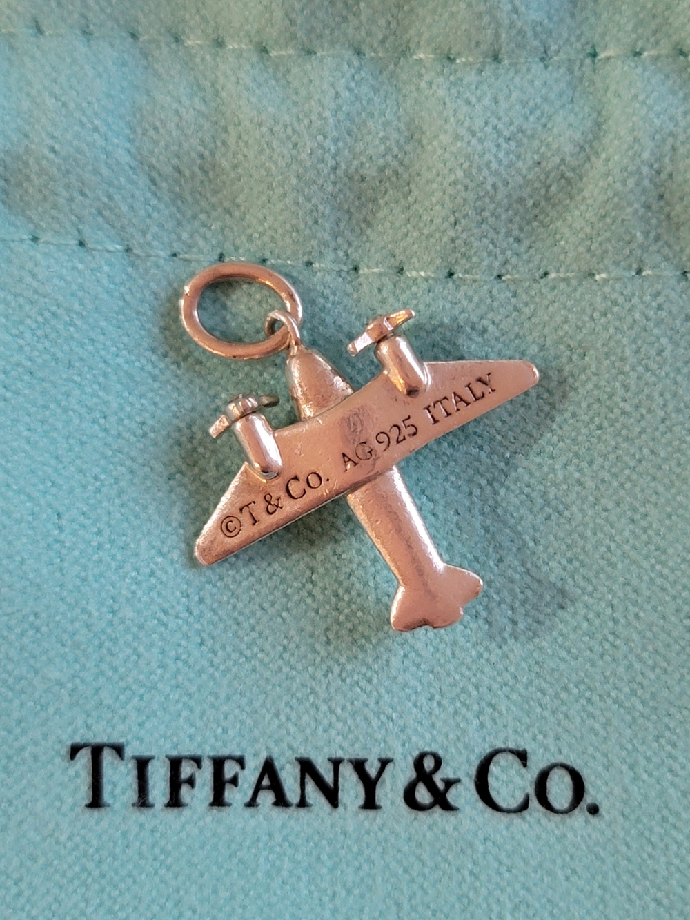 Tiffany & Co. Sterling Silver Airplane Charm on Tiffany Blue